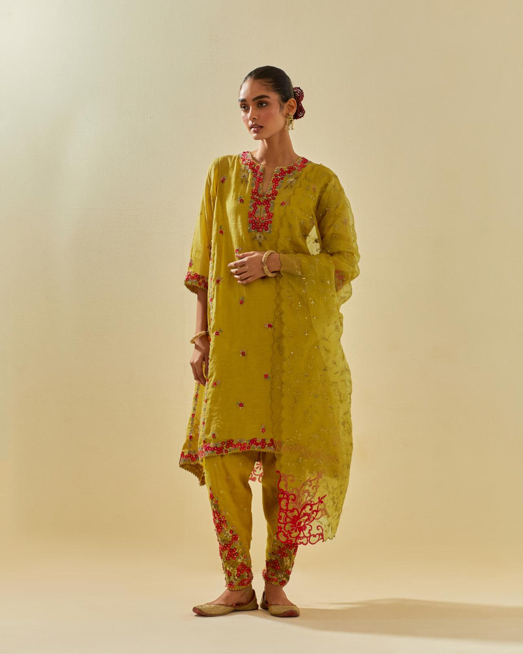 Yellow tissue chanderi mid length kalidar kurta set with hand cut silk flower embroidery, highlighted with gold sequins.