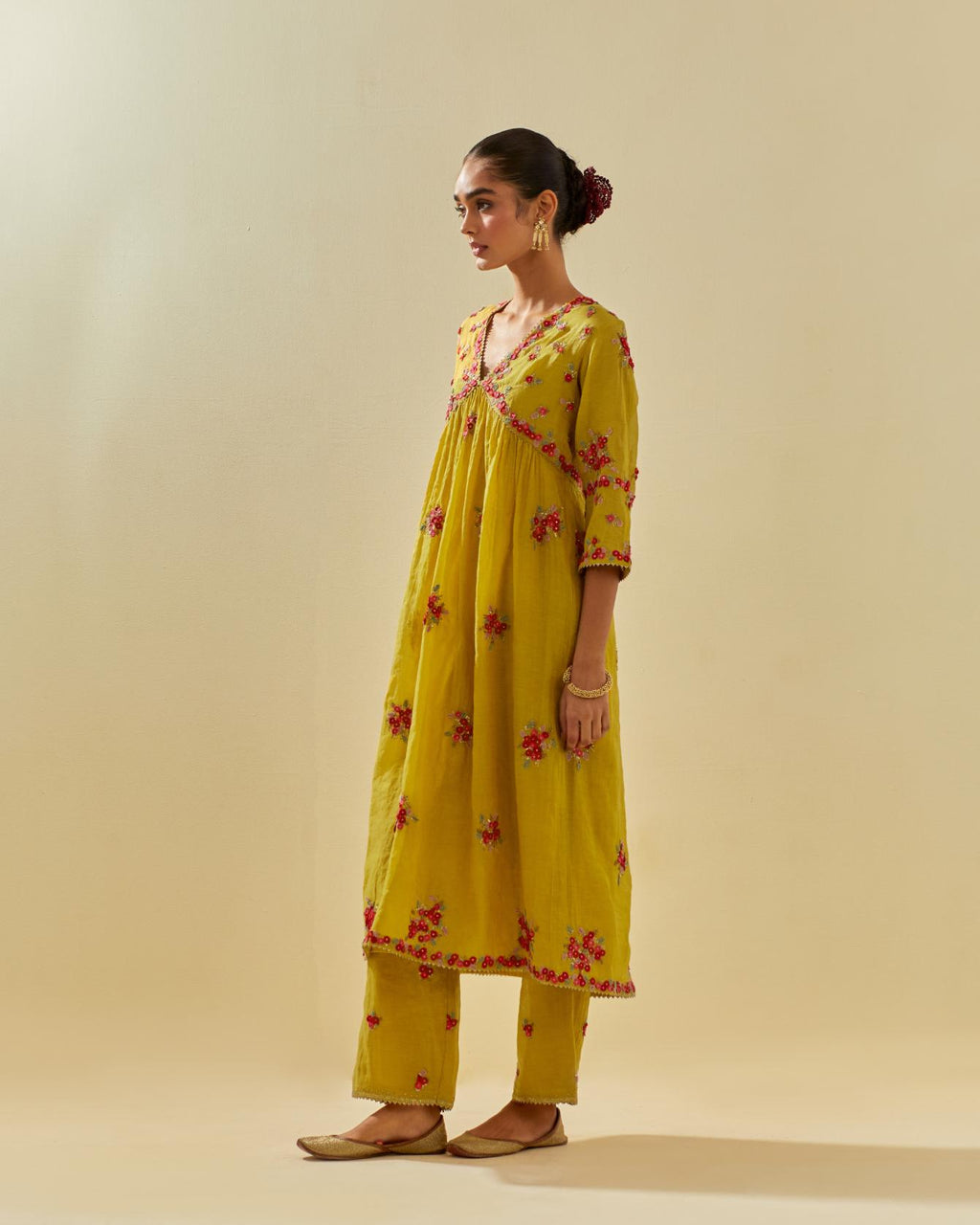 Yellow tissue chanderi hand cut silk flower embroidered kurta dress set with fine gathers at empire line.