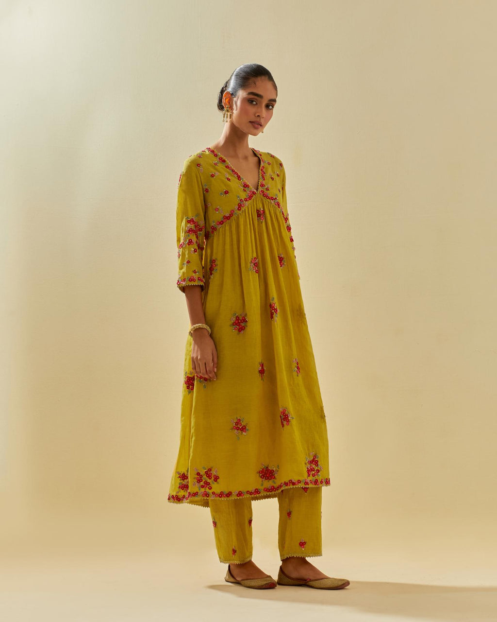 Yellow tissue chanderi hand cut silk flower embroidered kurta dress set with fine gathers at empire line.