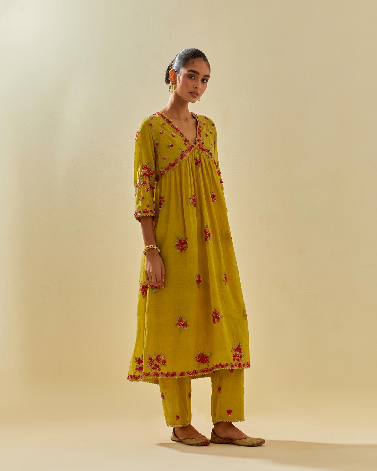 Yellow tissue chanderi hand cut silk flower embroidered kurta dress set with fine gathers at empire line.