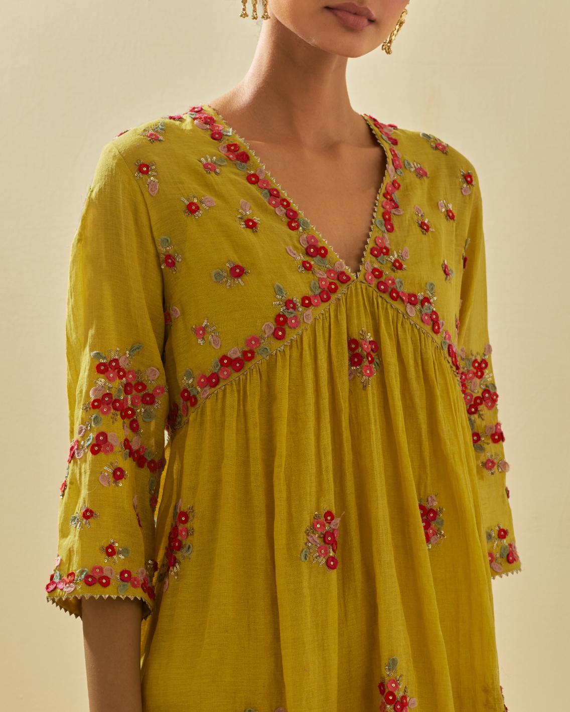 Yellow tissue chanderi hand cut silk flower embroidered kurta dress set with fine gathers at empire line.
