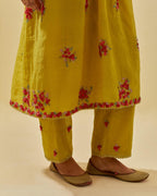 Yellow tissue chanderi hand cut silk flower embroidered kurta dress set with fine gathers at empire line.