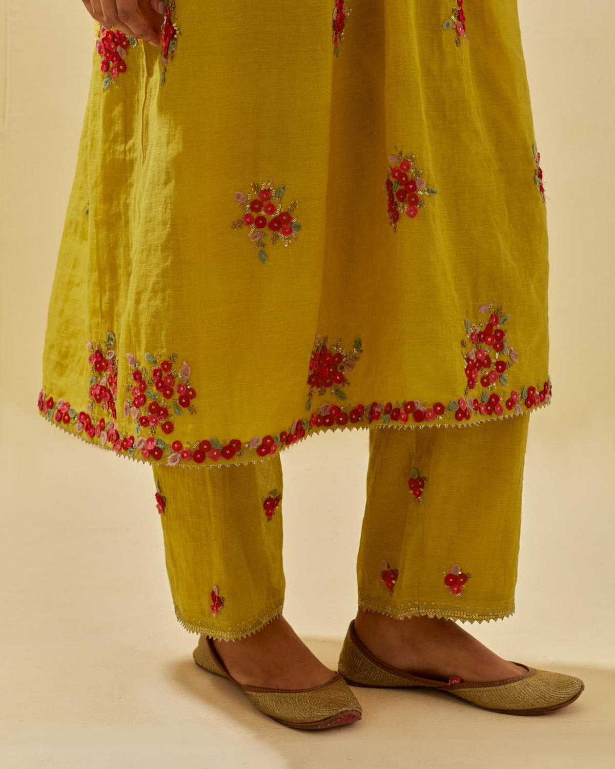 Yellow tissue chanderi hand cut silk flower embroidered kurta dress set with fine gathers at empire line.