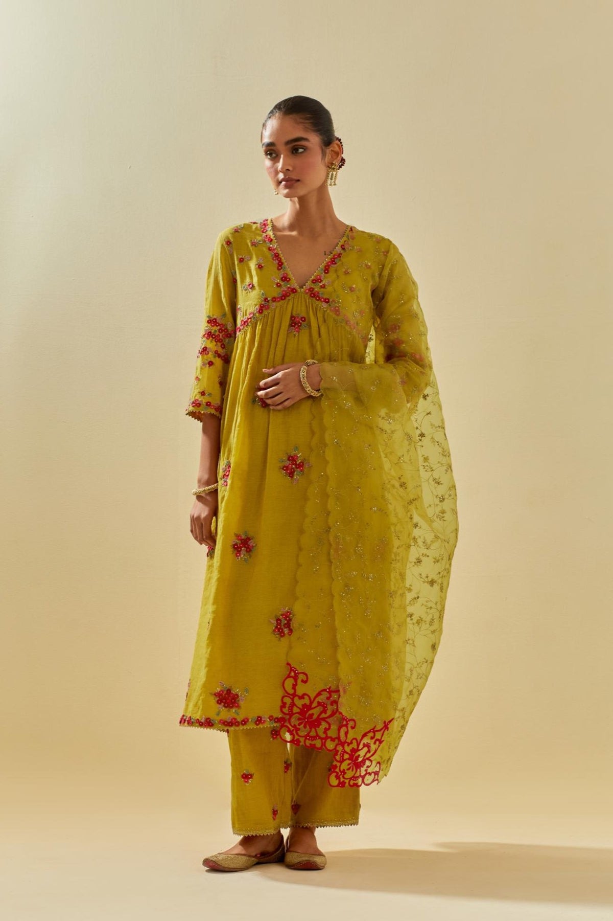 Yellow tissue chanderi hand cut silk flower embroidered kurta dress set with fine gathers at empire line.