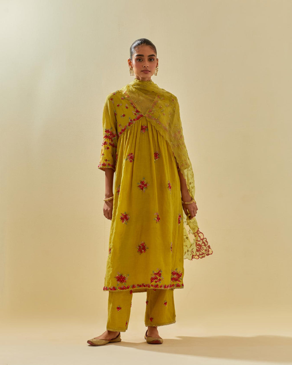 Yellow tissue chanderi hand cut silk flower embroidered kurta dress set with fine gathers at empire line.