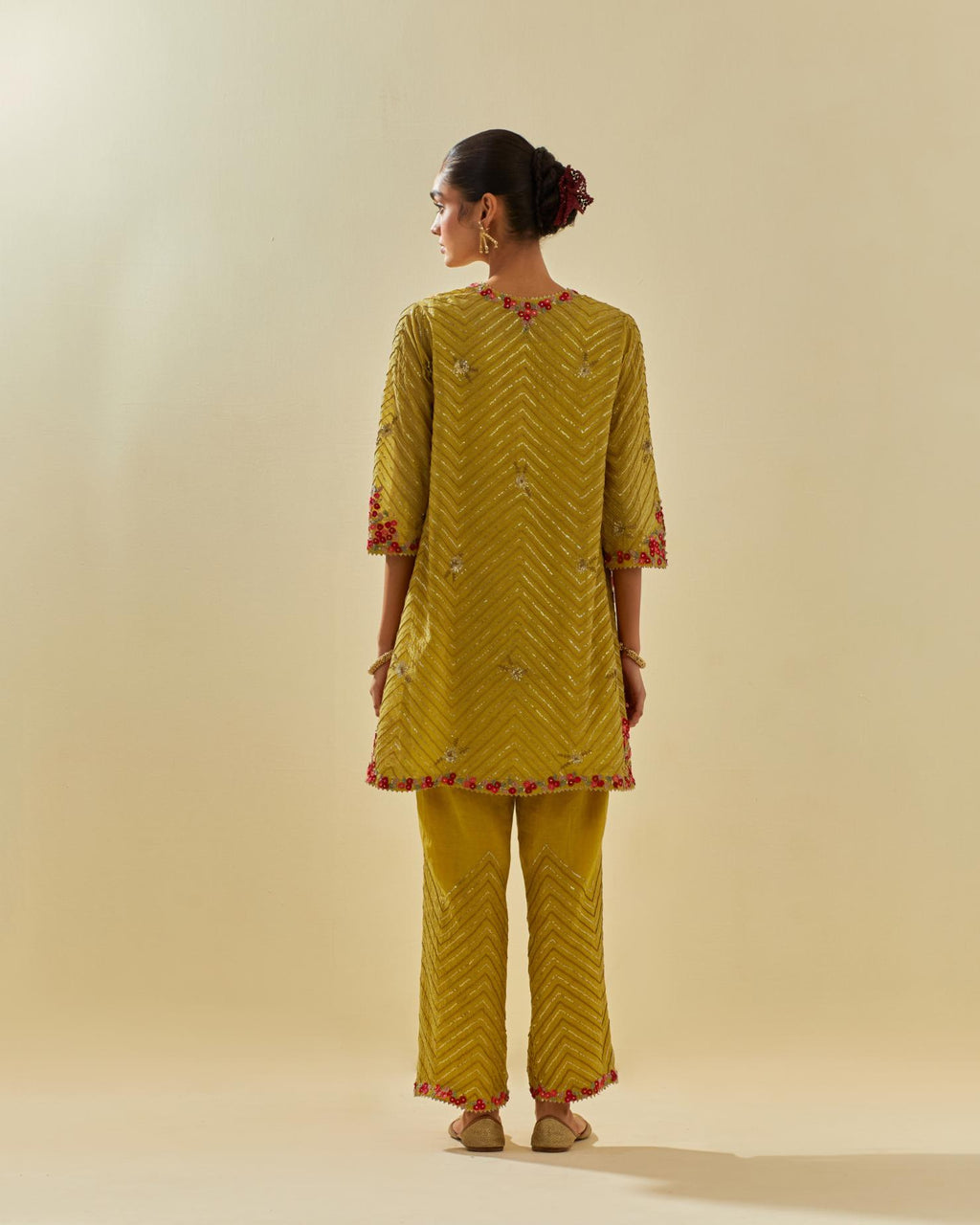 Yellow tissue chanderi easy fit short kurta set, highlighted with gold sequins and beads.