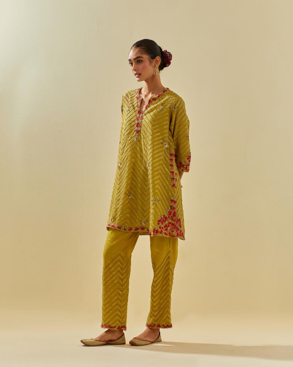 Yellow tissue chanderi easy fit short kurta set, highlighted with gold sequins and beads.
