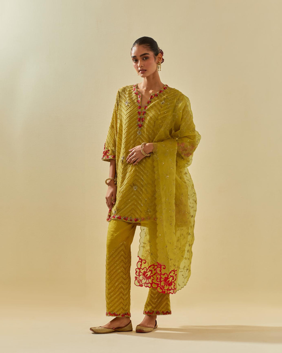 Yellow tissue chanderi easy fit short kurta set, highlighted with gold sequins and beads.