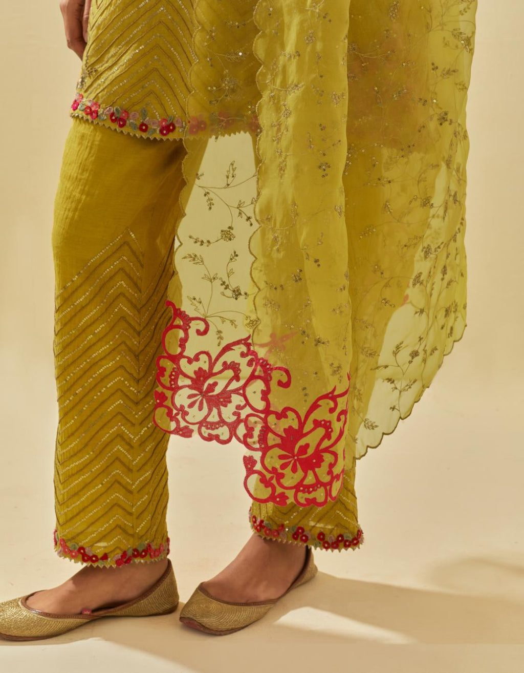 Yellow silk organza dupatta with all-over delicate gold zari embroidery & silk applique work, highlighted with gold sequins.
