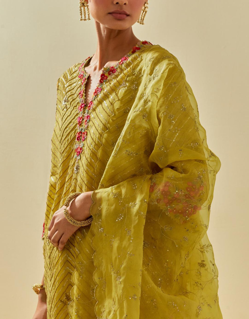 Yellow silk organza dupatta with all-over delicate gold zari embroidery & silk applique work, highlighted with gold sequins.