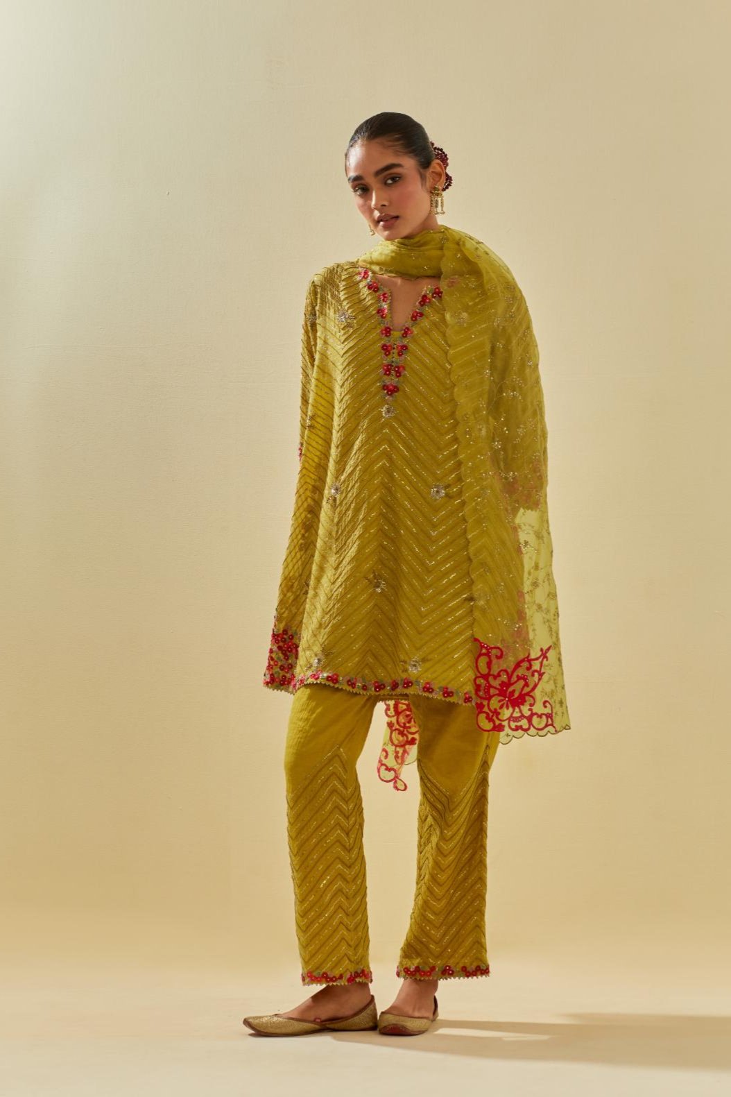 Yellow tissue chanderi easy fit short kurta set, highlighted with gold sequins and beads.