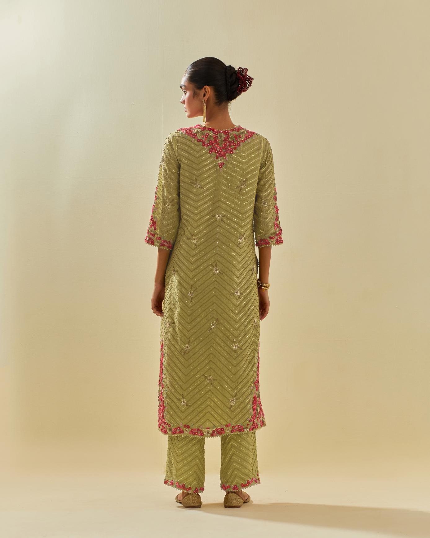 Green tissue chanderi straight kurta set with delicate hand cut silk flower embroidery, highlighted with gold sequins and beads.