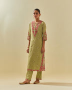Green tissue chanderi straight kurta set with delicate hand cut silk flower embroidery, highlighted with gold sequins and beads.