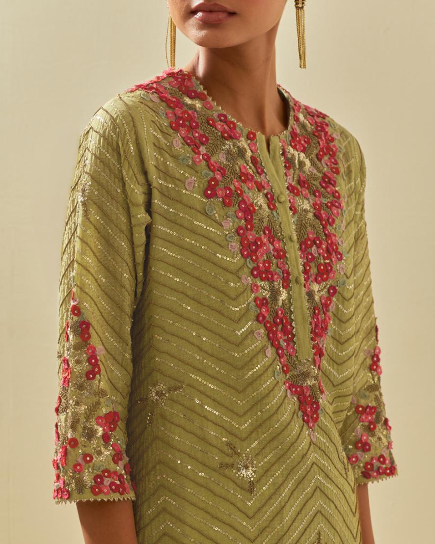 Green tissue chanderi straight kurta set with delicate hand cut silk flower embroidery, highlighted with gold sequins and beads.