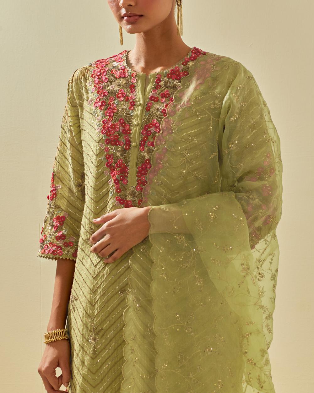 Green tissue chanderi straight kurta set with delicate hand cut silk flower embroidery, highlighted with gold sequins and beads.