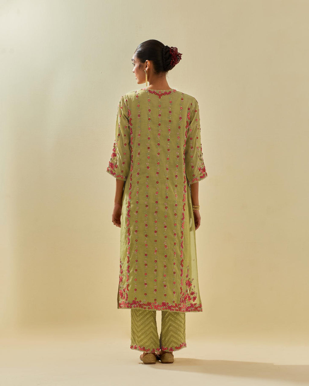 Green tissue chanderi paneled kurta set with front placket neckline and all-over hand cut silk flower embroidery.