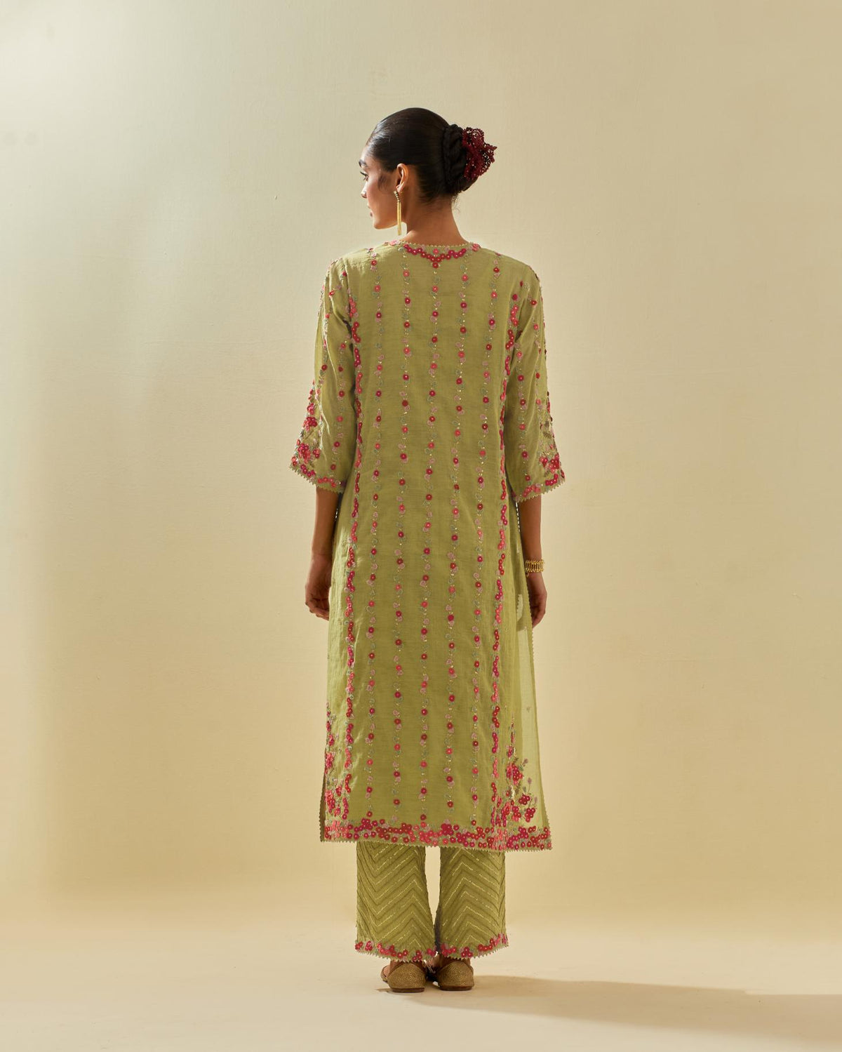 Green tissue chanderi paneled kurta set with front placket neckline and all-over hand cut silk flower embroidery.