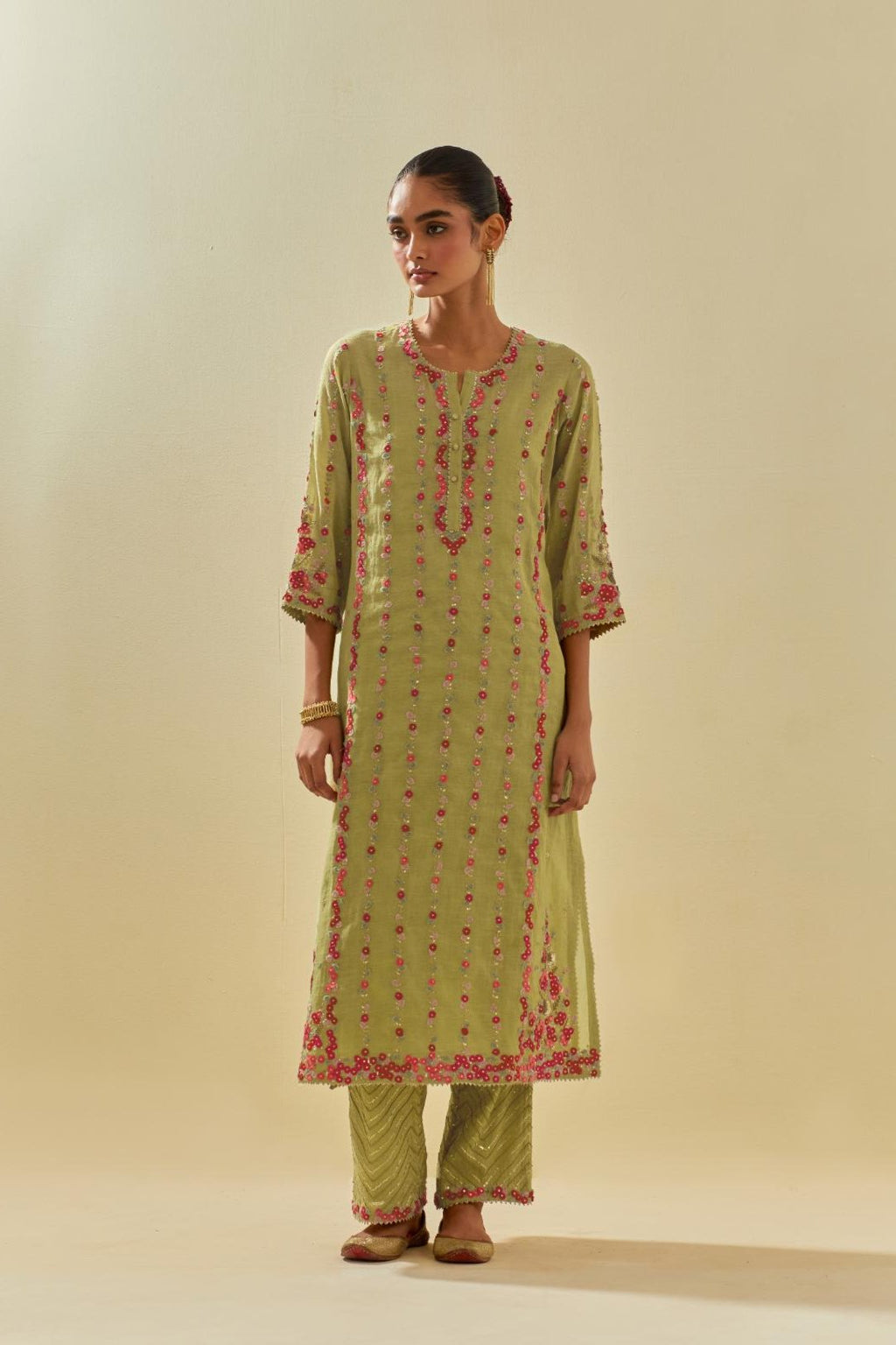 Green tissue chanderi paneled kurta set with front placket neckline and all-over hand cut silk flower embroidery.