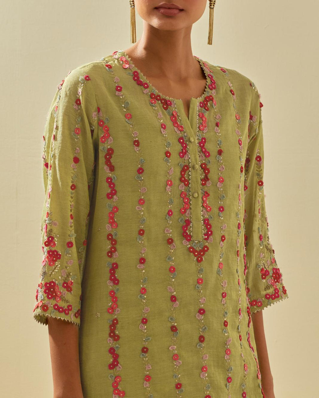Green tissue chanderi paneled kurta set with front placket neckline and all-over hand cut silk flower embroidery.