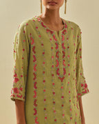Green tissue chanderi paneled kurta set with front placket neckline and all-over hand cut silk flower embroidery.