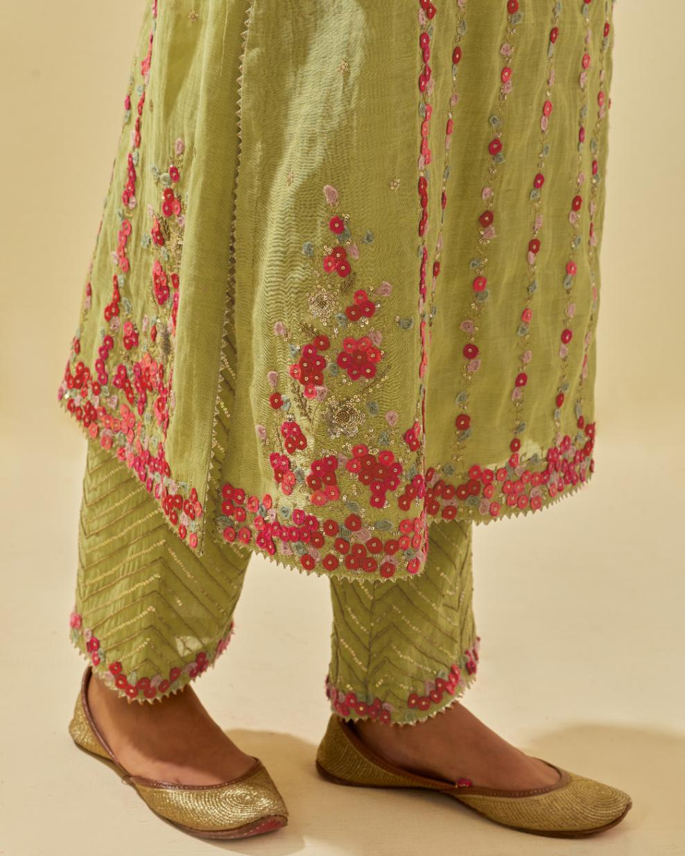 Green tissue chanderi paneled kurta set with front placket neckline and all-over hand cut silk flower embroidery.