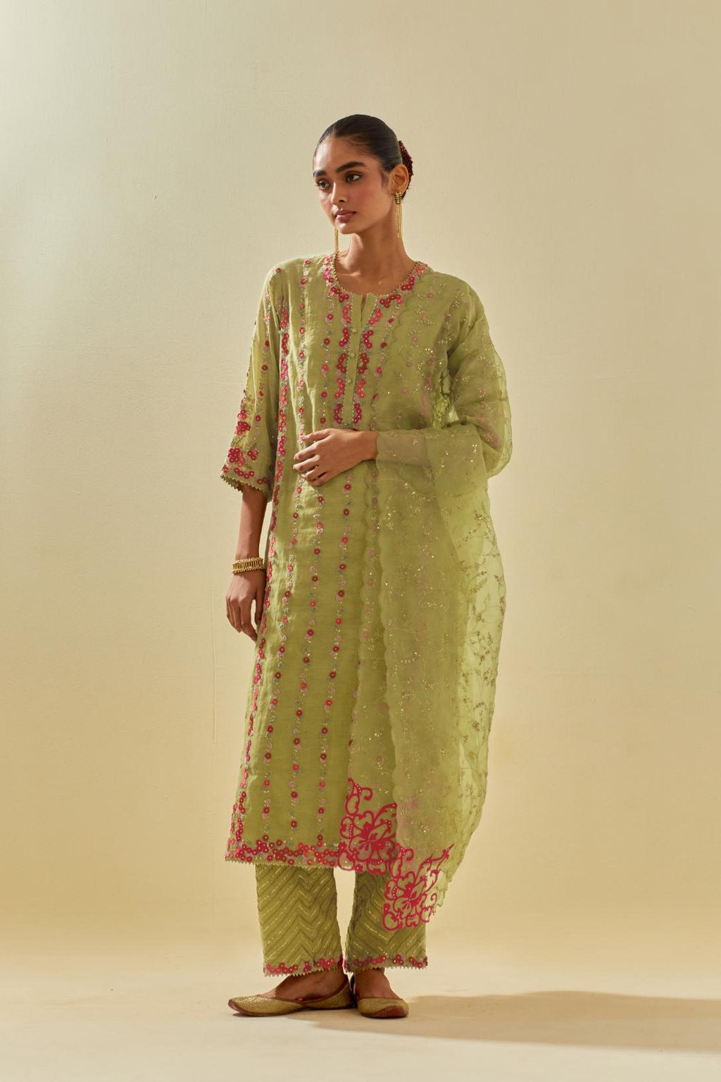 Green tissue chanderi paneled kurta set with front placket neckline and all-over hand cut silk flower embroidery.