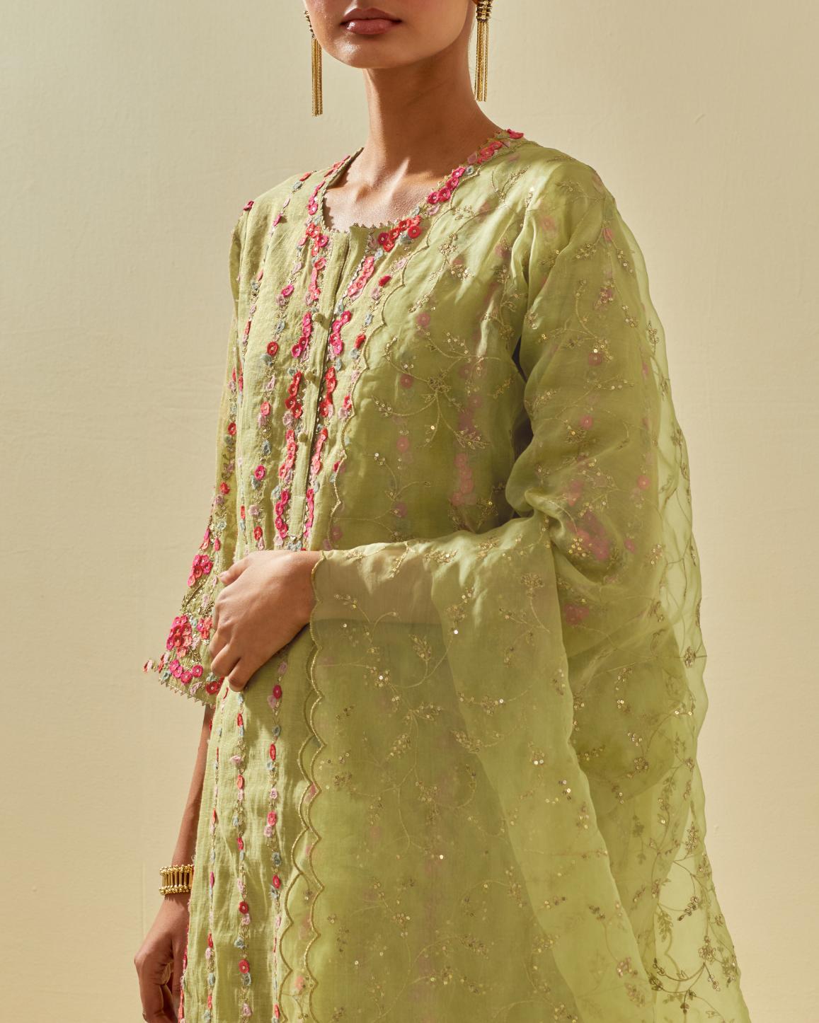 Green tissue chanderi paneled kurta set with front placket neckline and all-over hand cut silk flower embroidery.