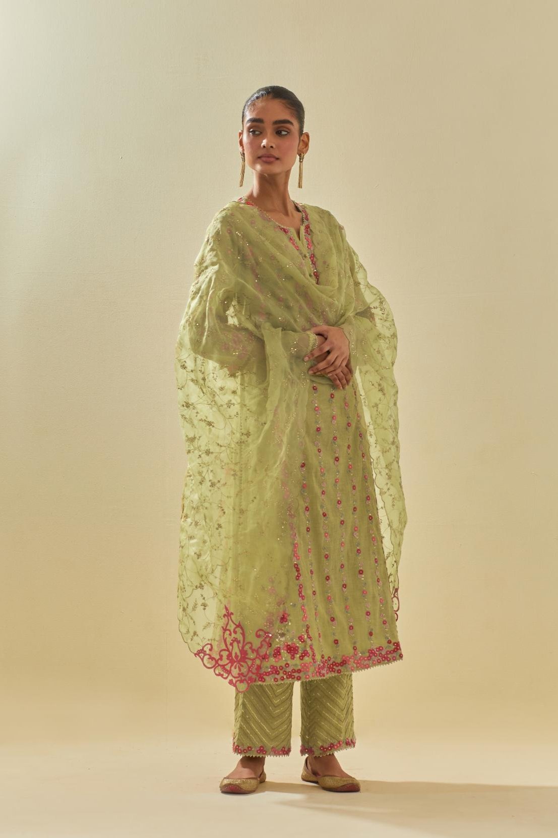 Green silk organza dupatta with all-over delicate gold zari embroidery & silk applique work, highlighted with gold sequins.