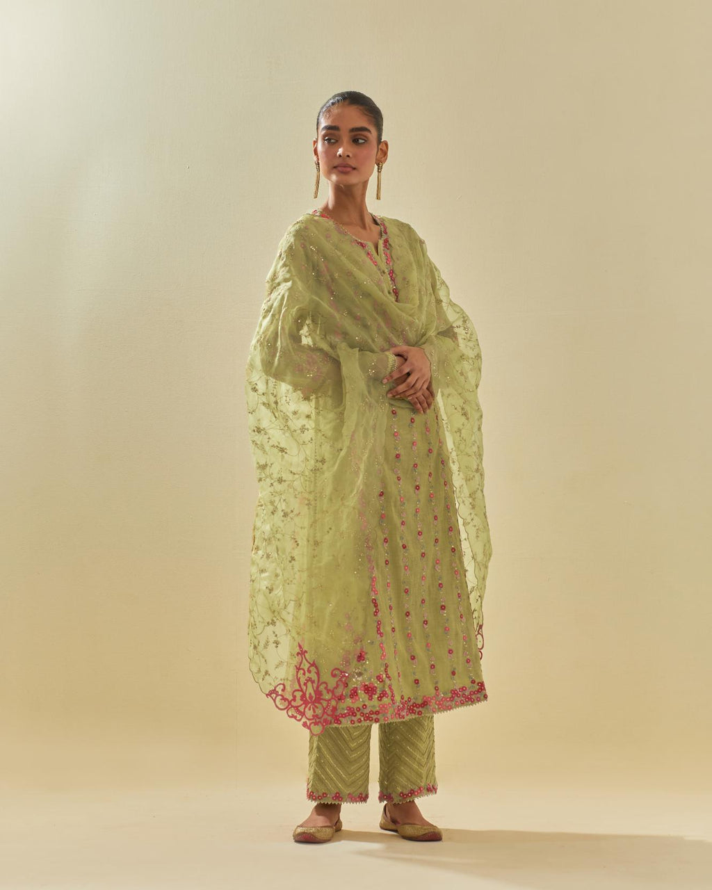 Green tissue chanderi paneled kurta set with front placket neckline and all-over hand cut silk flower embroidery.