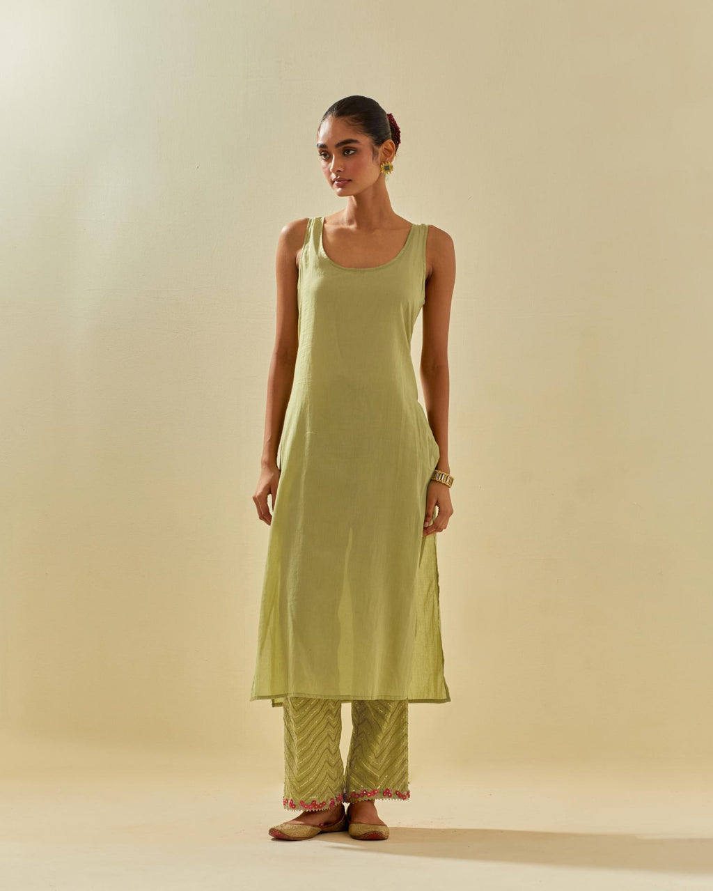 Green tissue chanderi straight kurta set, with contrast silk hand cut flowers embroidery, highlighted with gold sequins.