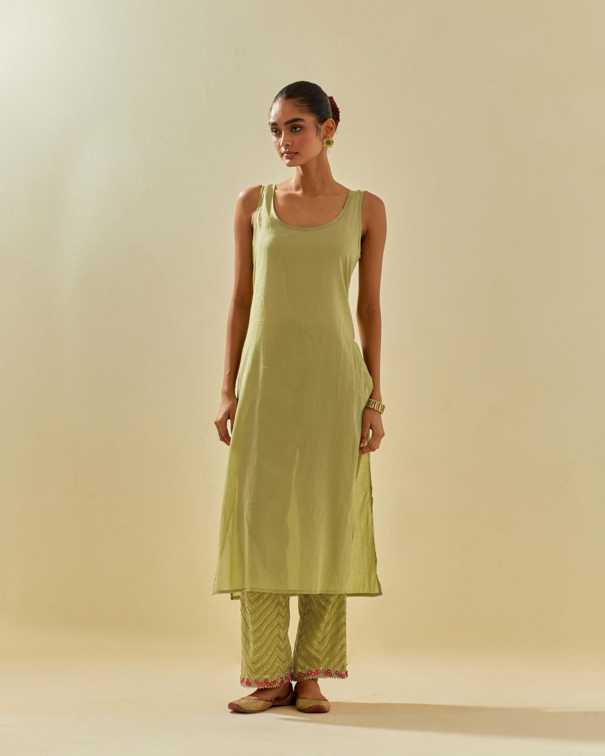 Green tissue chanderi straight kurta set, with contrast silk hand cut flowers embroidery, highlighted with gold sequins.