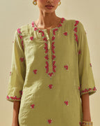 Green tissue chanderi straight kurta set, with contrast silk hand cut flowers embroidery, highlighted with gold sequins.