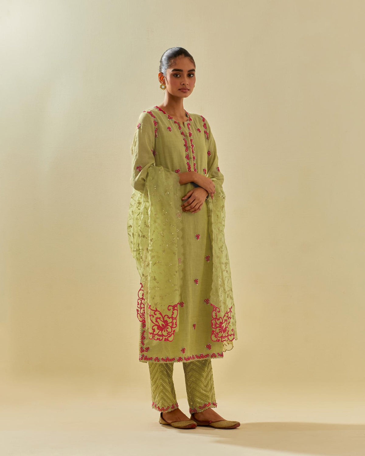 Green silk organza dupatta with all-over delicate gold zari embroidery & silk applique work, highlighted with gold sequins.