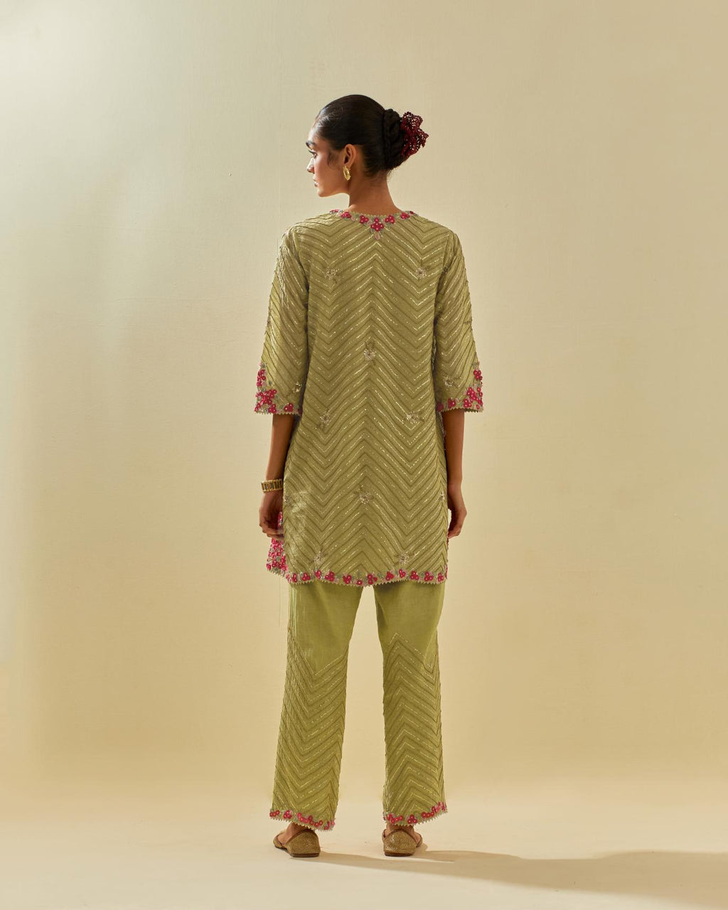 Green tissue chanderi easy fit short kurta set, highlighted with gold sequins and beads.