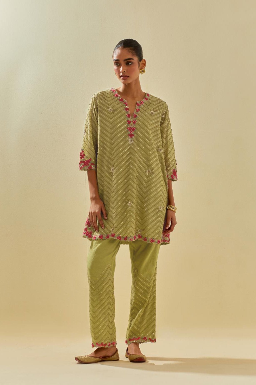 Green tissue chanderi easy fit short kurta set, highlighted with gold sequins and beads.