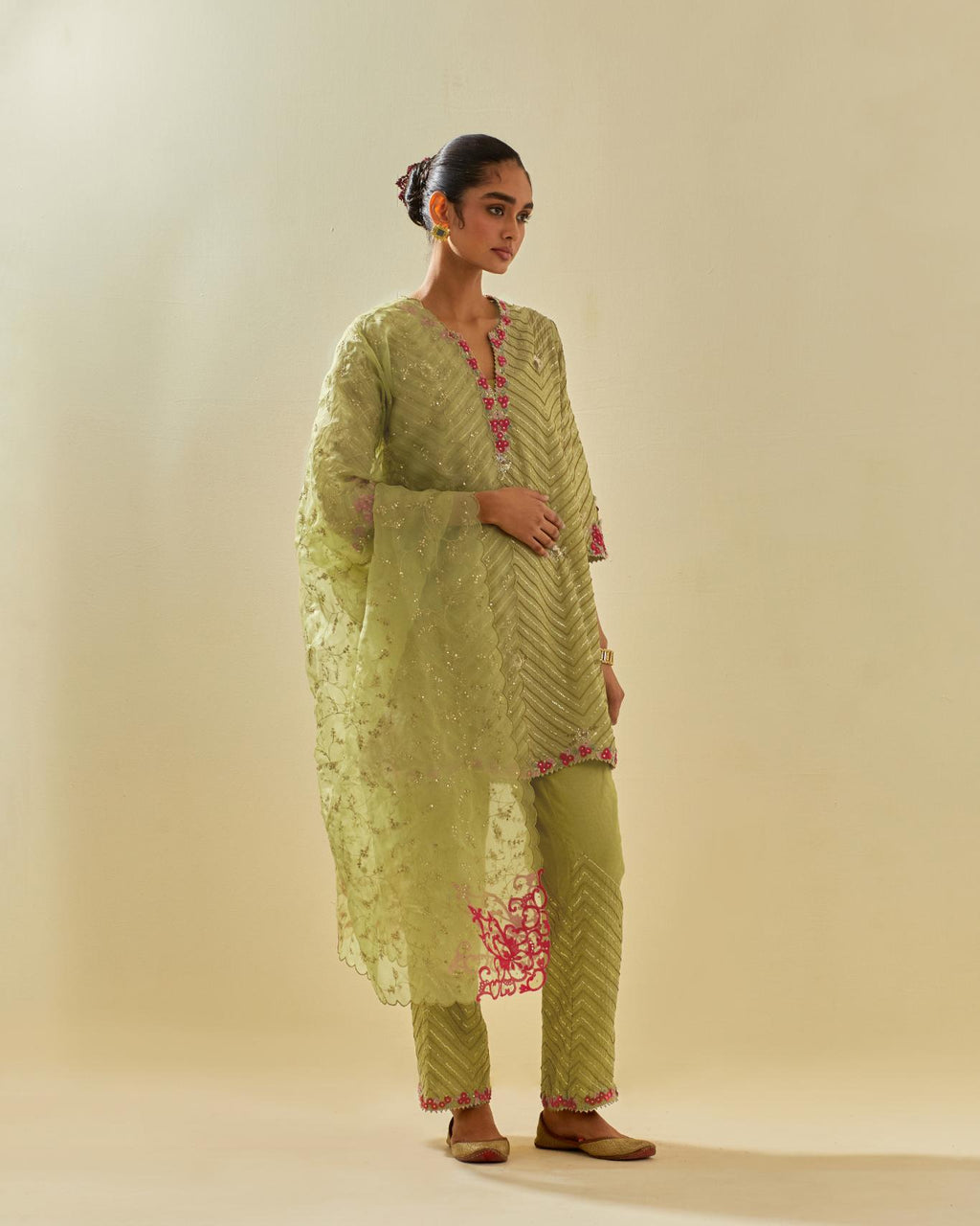 Green silk organza dupatta with all-over delicate gold zari embroidery & silk applique work, highlighted with gold sequins.