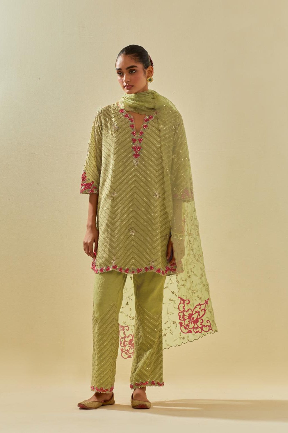 Green tissue chanderi easy fit short kurta set, highlighted with gold sequins and beads.