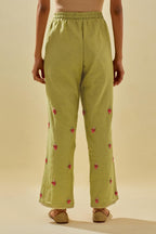 Green tissue chanderi straight pants with hand cut silk flower embroidered booti, highlighted with gold sequins.