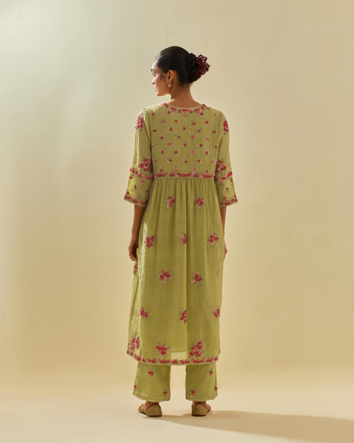 Green tissue chanderi hand cut silk flower embroidered kurta dress set with fine gathers at empire line.