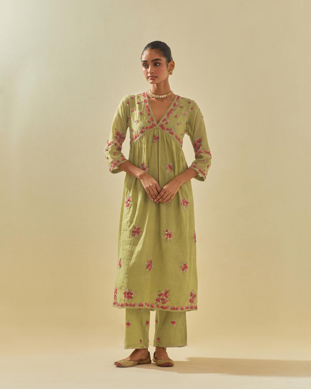 Green tissue chanderi hand cut silk flower embroidered kurta dress set with fine gathers at empire line.