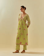 Green tissue chanderi hand cut silk flower embroidered kurta dress set with fine gathers at empire line.
