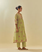 Green tissue chanderi hand cut silk flower embroidered kurta dress set with fine gathers at empire line.