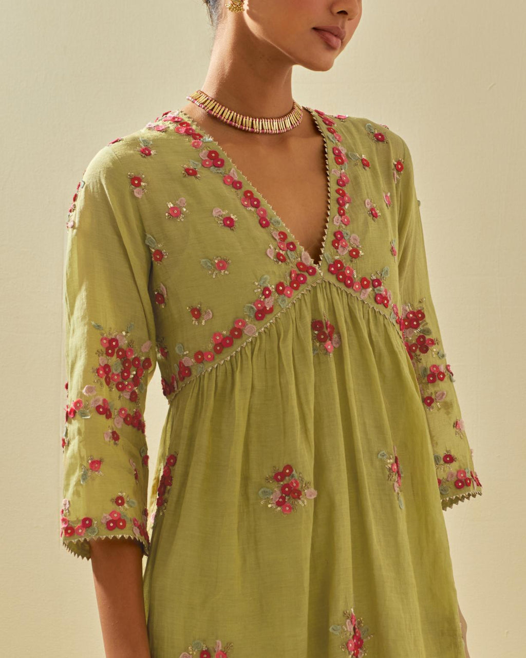 Green tissue chanderi hand cut silk flower embroidered kurta dress set with fine gathers at empire line.