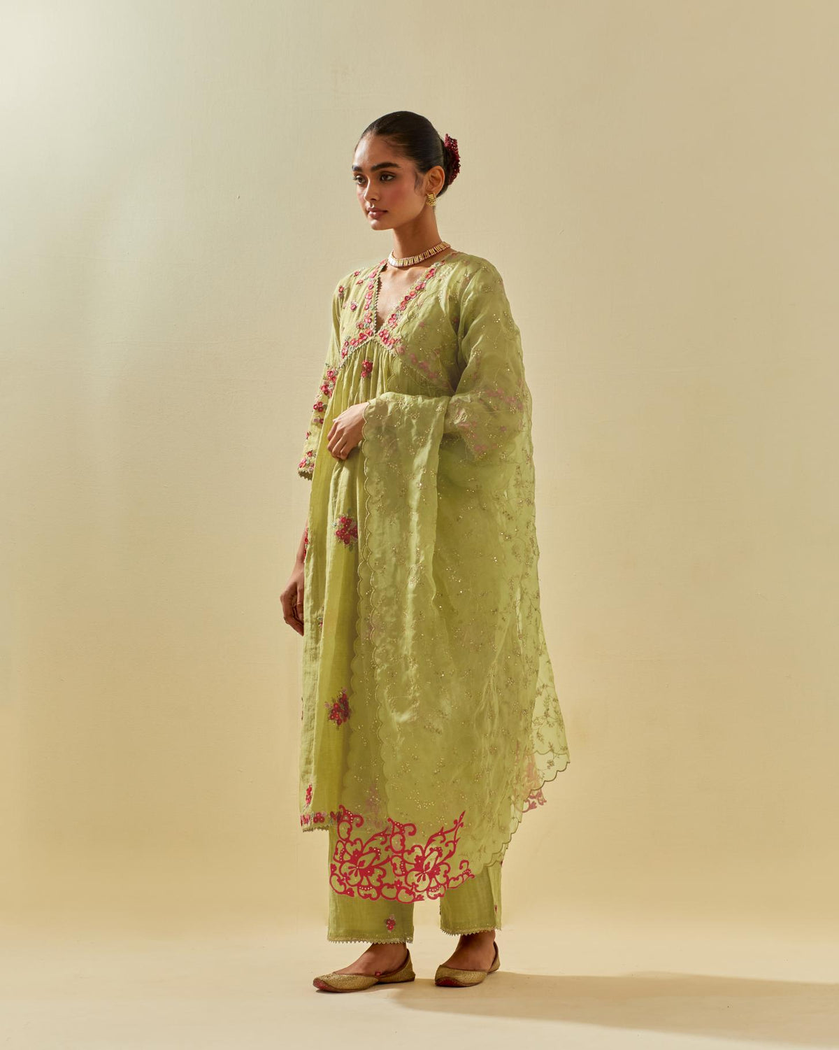 Green tissue chanderi hand cut silk flower embroidered kurta dress set with fine gathers at empire line.