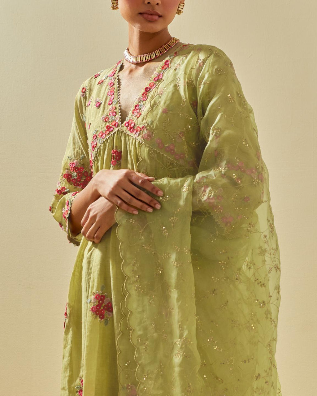 Green tissue chanderi hand cut silk flower embroidered kurta dress set with fine gathers at empire line.