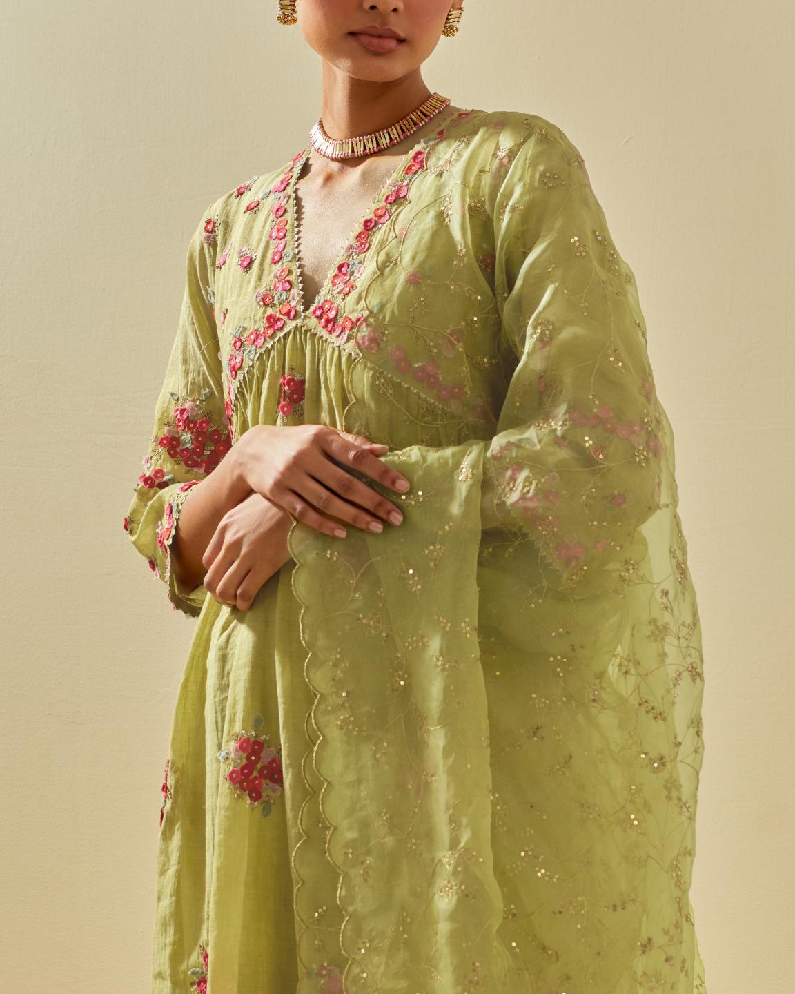 Green tissue chanderi hand cut silk flower embroidered kurta dress set with fine gathers at empire line.