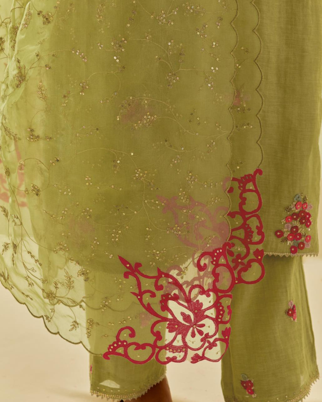 Green tissue chanderi straight kurta set with randomly placed hand cut silk flower bunches, highlighted with gold sequins.