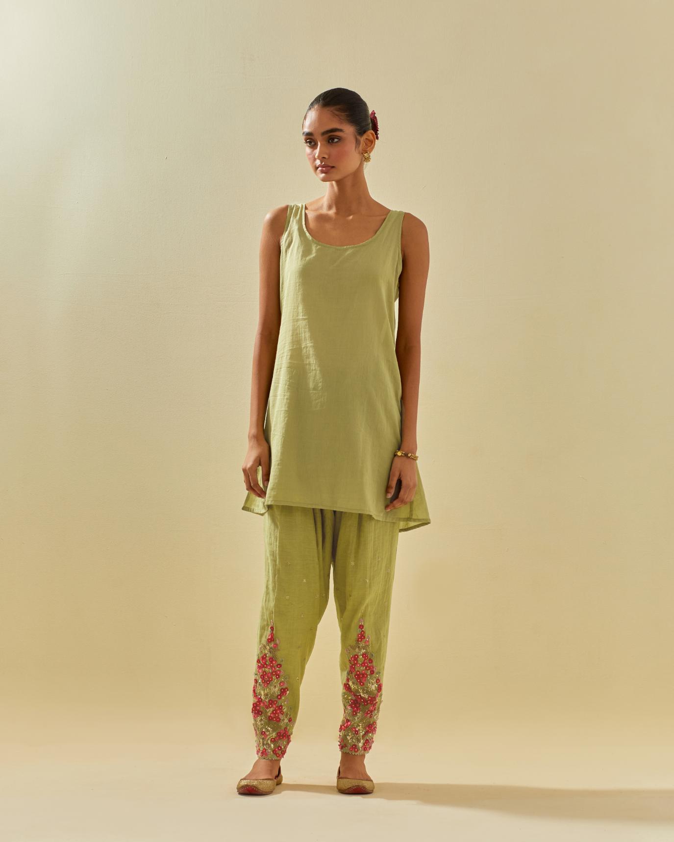 Green tissue chanderi mid length kalidar kurta set with hand cut silk flower embroidery, highlighted with gold sequins.