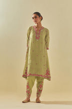 Green tissue chanderi mid length kalidar kurta set with hand cut silk flower embroidery, highlighted with gold sequins.