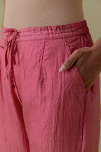 Pink Silk Hand-Block Printed Straight Pants with hand work at hem.